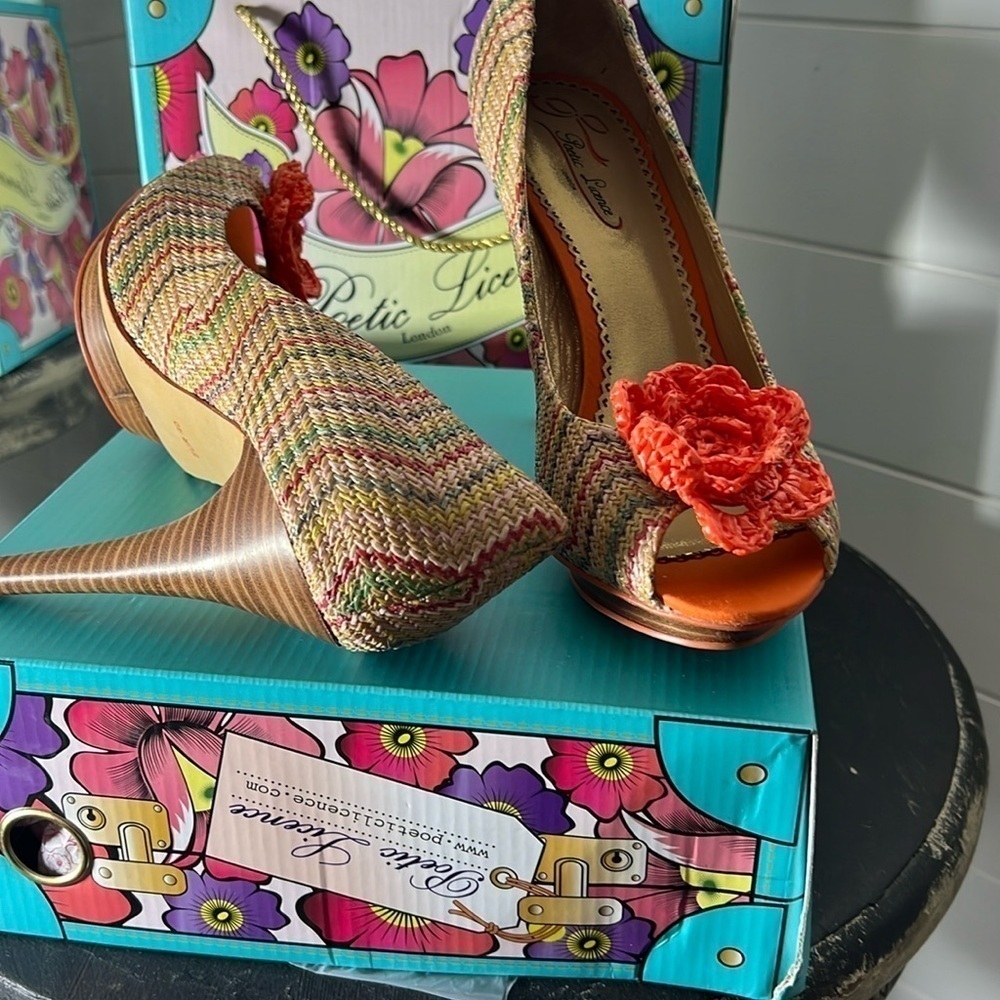 Woven multi color platform shoe with a bright orange crochet flower on toe! A407